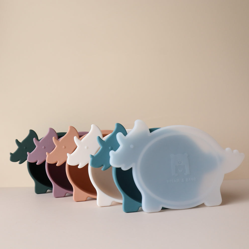 Set of colorful dinosaur-shaped silicone bowls